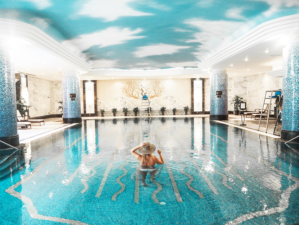 travel blogger Lisa Hamilton of See Want Shop swimming at the Intercontinental Shanghai Ruijin indoor pool
