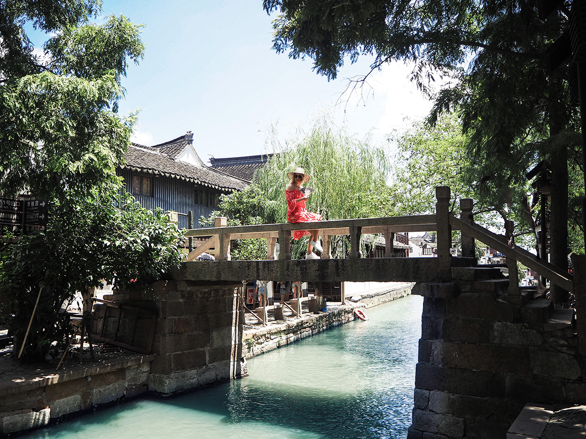 Travel blogger Lisa Hamilton visiting the canals at Zhujiajiao Ancient Water Town near Shanghai