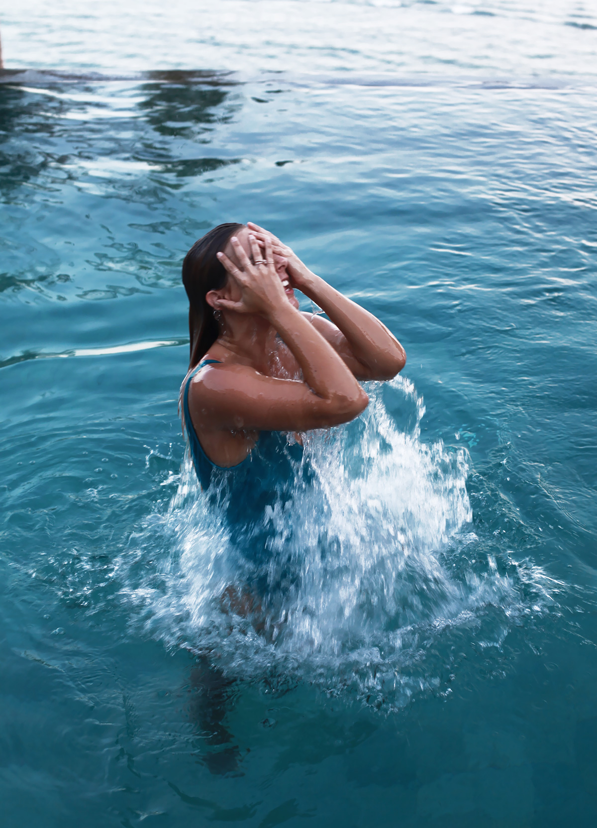 Blogger Lisa Hamilton from See Want Shop swimming at a tropical health retreat